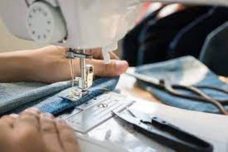 A sewing machine operator is a textile worker who typically works in a fashion business